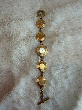 Coach Gold Tone Circular Medallion Bracelet Watch